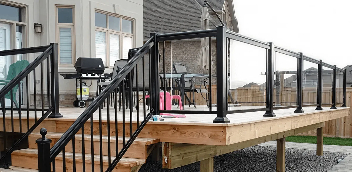 Handrail installation on a deck staircase for safety and code compliance in Madison, WI